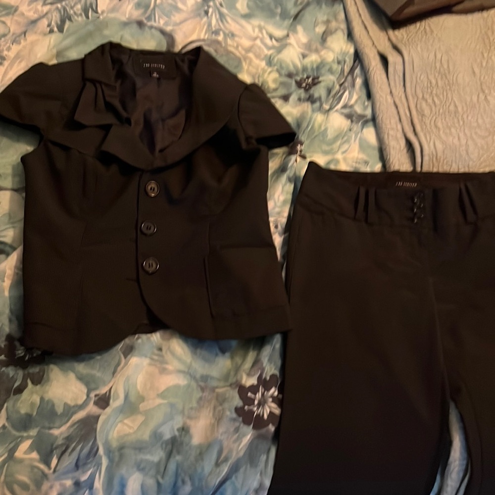 The limited black pin stripe suit size xs/0